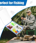 Angler sitting on dock with 4 Pack Mini Waterproof Tackle Box Organizer For Fly Fishing, Compact Fly Box With Dividers and gear.