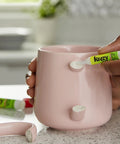 Person using All Purpose Glue With Precision Tip For Easy Home Repairs 2 G Bottles 2 Count Bonds Plastic Ceramic Wood Rubber Metal Leather And More Stay Fresh Container For Longevity to fix a ceramic mug handle.