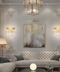Elegant living room with Gold Crystal Wall Sconce Lighting Fixture With Four Tier K9 Crystals flanking a modern art piece.