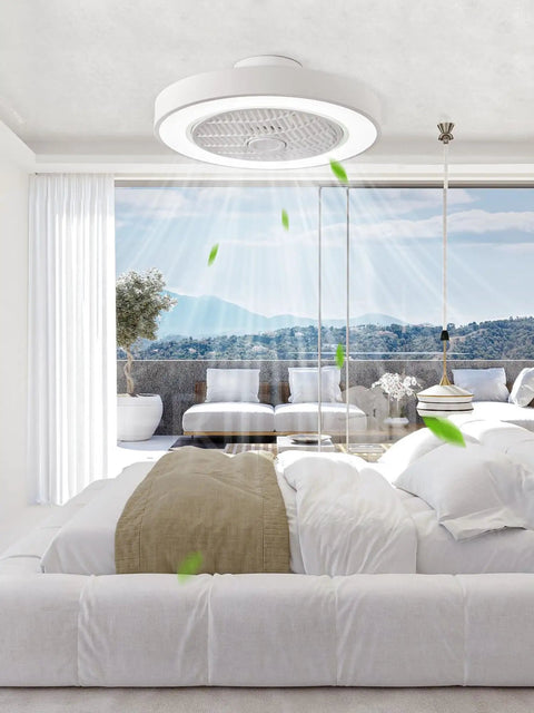 20 Inch Low Profile Bladeless Ceiling Fan With Dimmable LED Light and Adjustable Brightness in a bright room over a cozy bed.