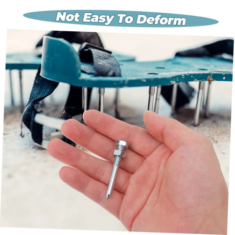 Hand holding spike with Heavy Duty Lawn Aerator Shoes Spikes Set With 20 Metal Spikes For Grass Shoes visible in background