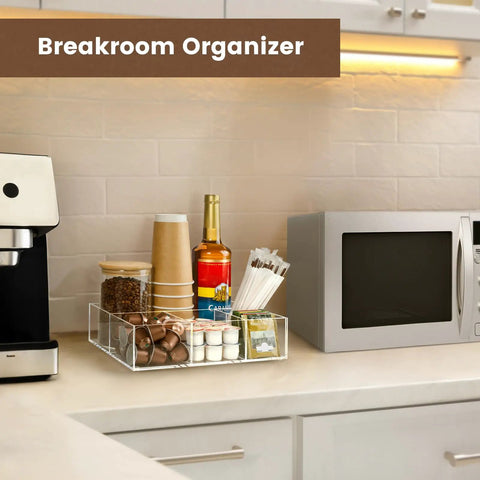 Clear Acrylic Coffee Station Organizer For Countertop And Office Breakroom Keeps K Cup Pods Condiments Sugar Creamers Syrups Tea Bags And More Neatly Accessible A Tidy Coffee Bar Essential And Gift For Coffee Lovers on countertop with coffee supplies.