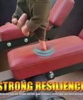 Finger pressing foam pad on squat bar with shoulder pads for strength training and arm weight, heavy duty T bar handle, red cushion, black steel frame