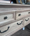 Close-up of dresser with Vintage Flower Pattern Cabinet Knob Set 10 Pcs Antique Brass Hardware For Cabinets Drawers And Doors.