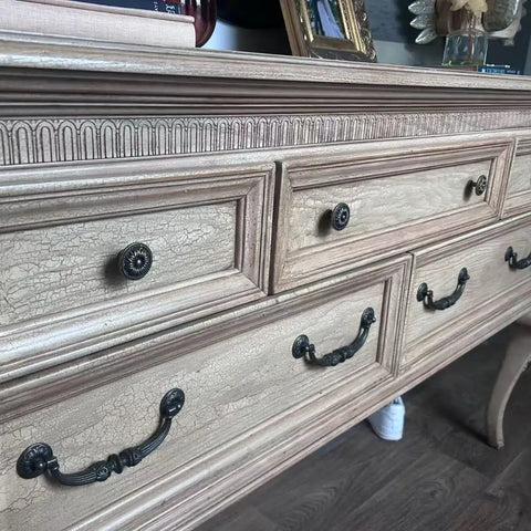 Close-up of dresser with Vintage Flower Pattern Cabinet Knob Set 10 Pcs Antique Brass Hardware For Cabinets Drawers And Doors.
