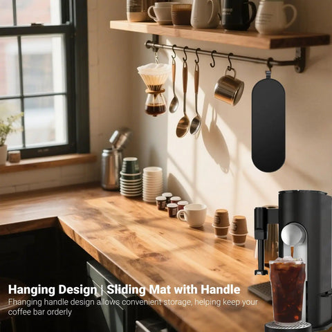 Kitchen counter with coffee accessories and Sliding Pad For Single Serve Coffee Makers PB051 PB041 hanging by handle.