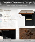 54 Inch Farmhouse Kitchen Cart Featuring A Nifty Power Outlet And Hefty Storage Space With Smooth Rolling Lockable Wheels And Sleek Black Finish, showcasing drop leaf countertop design.