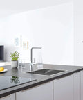 Clean Lines Single Handle Pull Out Kitchen Faucet With Laminar Spray Led Knobs For Chilled Sparkling Water Butter Smooth Pour 180 Swivel Spout Real Game Changing Kitchen Upgrade in modern kitchen setting.