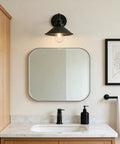 Black Industrial Wall Sconce With 8.1 Inch Metal Shade Vintage Retro Vibe 1 Light Wall Lamp installed above bathroom mirror.