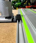 Guide Rail Adapter Compatible With Bosch Colt 1Hp Router For Track Saw Systems mounted on a guide rail with a hardwood base.