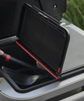 Person using Weather Resistant Outdoor Storage Bin For Grill Tools And Gear With Hinged Lid Grab And Go Drop In Fit For Grill Side Tables And Open Carts Keeps Tools Handy Durable Organizer on grill.