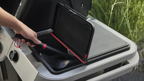 Person using Weather Resistant Outdoor Storage Bin For Grill Tools And Gear With Hinged Lid Grab And Go Drop In Fit For Grill Side Tables And Open Carts Keeps Tools Handy Durable Organizer on grill.