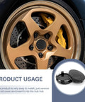 Easy Snap On Wheel Center Caps 4 Pack ABS Hub Covers OD 56 MM ID 60 MM Universal on a gold rim with black cover visible.