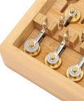 Close-up of Pro Grade Mainspring Winder Tool Kit With Copper Construction in a wooden storage box, showing precision winders.
