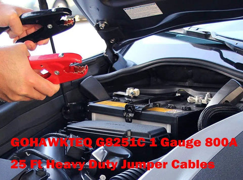 Hands holding Heavy Duty Jumper Cables 1 Gauge 25 Foot 800 Amp connecting to a car battery for jump starting.