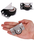 Low Profile Fixed Caster Wheels For Narrow Furniture Spaces Ideal For Drawers Cabinets And Trundle Beds Side Mount Non Swivel One And A Quarter Inch Small Wheel Set Of Four Load Thirty Six Lbs Each Concealed Design For Easy Furniture Renovation, shown in hand for scale