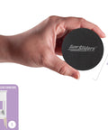 Hand holding Round 2.5 Inch Reusable Small Furniture Sliders For Hardwood Floors Move Light Items Easily And Protect Floors