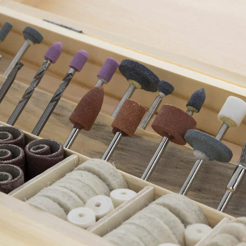 Close-up of rotary tool bits from 228 Piece Deluxe Universal Rotary Tool Accessory Kit For Sanding Polishing And Cutting Fits All Rotary Tools Including Dremel 1/8 Inch Shank Bands Fiber Cutoff Wheels Abrasive Wheels Wool Buffing Pads Aluminum Oxide Discs And More.