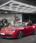 Hexagon LED Garage Lights Honeycomb Grid Panels 672W 80640LM 6500K in garage with red sports car underneath