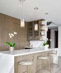 Dual Glass Pendant Lights 2 Pack With Brushed Nickel Finish illuminating a modern kitchen island