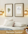 Slick Vintage Gold Wireless Wall Sconces Set Of Two Rechargeable Battery Operated Lights With Amber Stripe Glass Shades And Remote in cozy bedroom.
