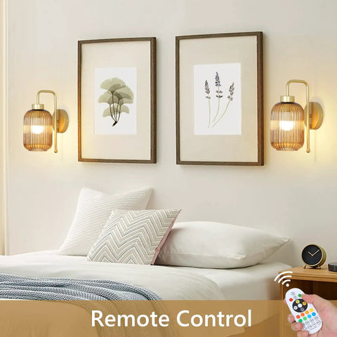 Slick Vintage Gold Wireless Wall Sconces Set Of Two Rechargeable Battery Operated Lights With Amber Stripe Glass Shades And Remote in cozy bedroom.
