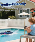 Father and son playing with Fast 15 MPH RC Boat For Pools And Lakes With 3 Speed Modes Dope LED Light Show Dual Batteries by a pool.