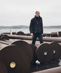Man wearing Men's Waterproof Shell Jacket With Detachable Hood And High Collar, Breathable Fully Taped Seams, Black Large, outdoors
