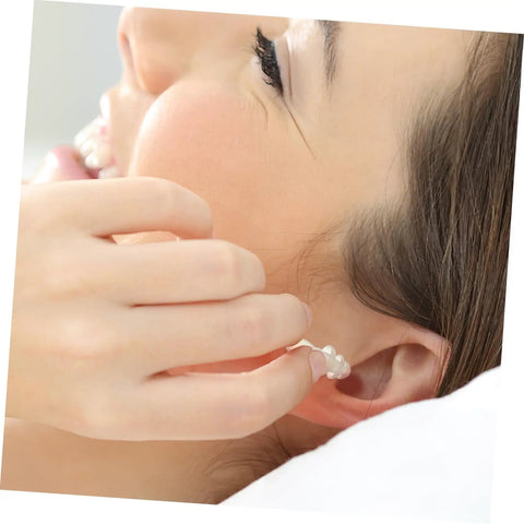 Person inserting Snag These 40 Count Reusable Silicone Ear Plugs Soft Tight Seal Keeps Ears Dry Swimming Or Showering Noise Blocking Cushion.