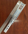 Pro Level Heavy Duty Full Extension Drawer Slides Six Inch Telescopic Ball Bearing Cabinet Rails with ruler for scale.
