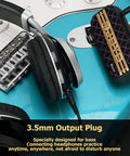Close-up of Portable Guitar Headphone Amp For Quiet Practice, JA-01 connected to electric guitar, showing 3.5mm headphone jack