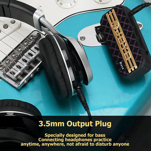 Close-up of Portable Guitar Headphone Amp For Quiet Practice, JA-01 connected to electric guitar, showing 3.5mm headphone jack