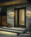 Large Outdoor Porch Light Wall Mount 15 Inch Sconce With Seeded Glass, black aluminum, illuminating a modern doorway.