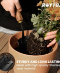 Person using Five Piece Garden Tool Set With Stainless Steel Heads And Ergonomic Walnut Handles to plant in a pot