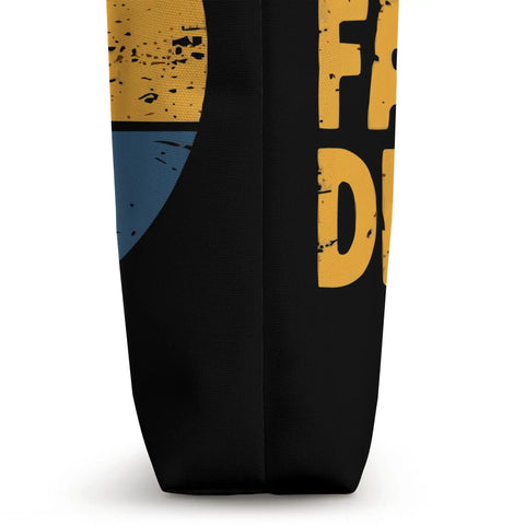 Side view of Dragon Boat Racing Tote Bag For Paddlers with bold text design, showcasing a multicolored graphic on black fabric.