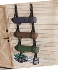 Heavy Duty Adjustable Wall Storage Straps For Garage Organization Rock Solid Wall Mount System showing three color-coded straps holding items.