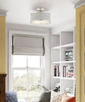 Two Light Brushed Nickel Semi Flush Ceiling Light With Gray Fabric Hardback Shade 11x11x8 Inches installed in a cozy room