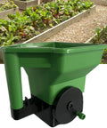 Handheld Garden Spreader For Seeds, Fertilizer And Salt Portable Manual Dispenser in garden setting