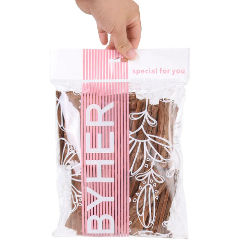 Straight Up Essential 4 Inch Craft Sticks, 45 Pcs Natural Wood Twigs With Original Bark in clear packaging, hand holding.