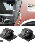 Premium Adhesive Cable Management Clips Super Sticky Backing Clean Pop Off No Damage Wire Cord Organizers For Home Office Desk Tidying Solution Heavy Duty Plastic Holder Gonna Lock In Tight in car, holding charging cable.