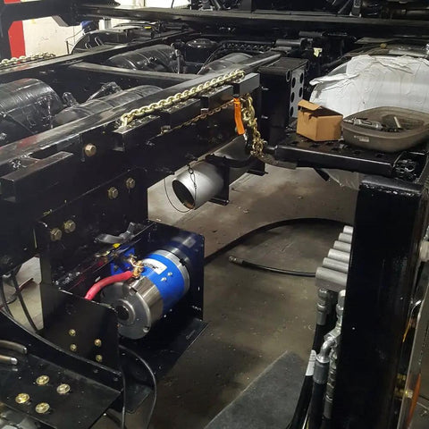 Electric Hydraulic Totally Enclosed Pump Motor For Auto Transport And Car Hauler Use 170-009-0001B installed in vehicle chassis.