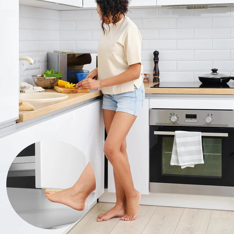 Woman opening trash cabinet with foot pedal in kitchen, showcasing Trash Cabinet Foot Pull Hands Free Foot Pedal Opener For Drawers Bins And Cabinets