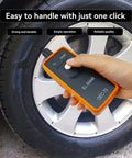 No Fuss Slick TPMS Relearn Tool and Tire Pressure Sensor Reset Adapter EL50448 held by a hand near a car tire.