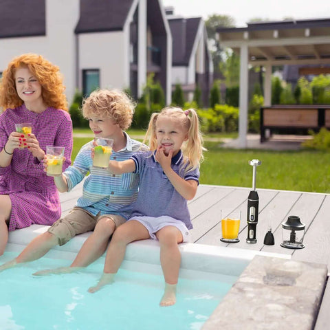 Family enjoying drinks by poolside with Cordless Immersion Blender Handheld Mixer With Extended Battery Life And Fast Usb Charging.