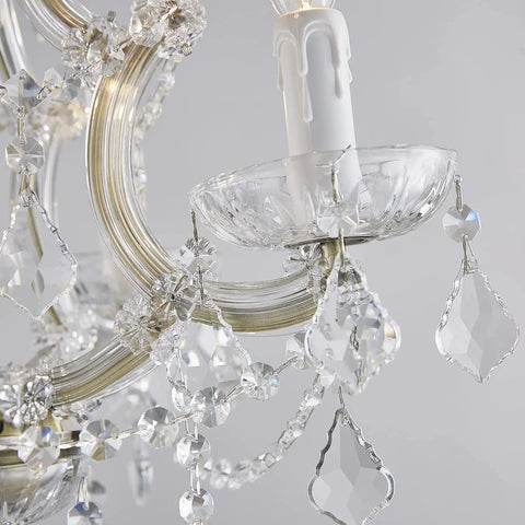 Four Light Maria Therese K9 Crystal Chandelier With Antique Brass Finish close-up, showing intricate crystal details