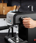 Your New Favorite Hustle Free Automatic Espresso And Cappuccino Maker Featuring Boss Level 15 Bar Pressure And Thermal Heating For Truly On Point Lattes In Silver And Black, close-up of control knob being adjusted.