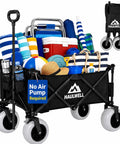 All Terrain Beach Wagon With Big Sand Wheels, Ultra Durable Collapsible Beach Cart For Kids And The Crew, Camping And Outdoor Adventures, Folding Cart With 9-Inch Foam-Filled Tires For Smooth Haul On Sand, Grass And Gravel loaded with beach gear.