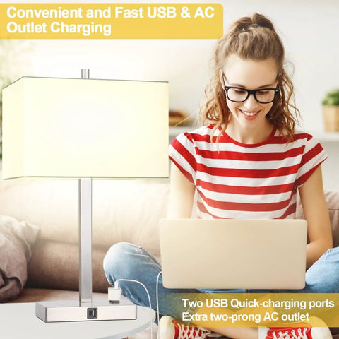 Woman using laptop beside 21 inch touch bedside lamp set of 2 with USB and AC outlets, 3 way dimmable in white shade