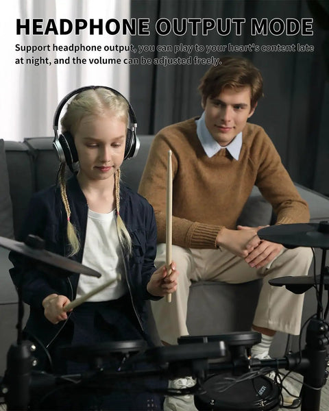 Young girl playing Electric Drum Set for Beginners With 150 Sounds and Quiet Pads 2 Pedals Ready To Jam Throne Sticks Headphones Included as adult watches.