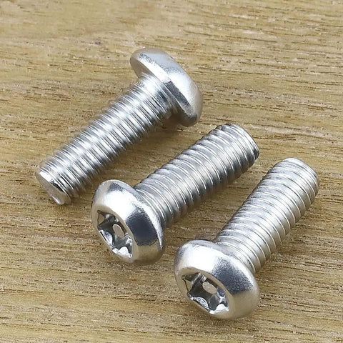 Badass M6 Security Torx Button Head Machine Screws 30 Pack Kit With Included T30 Driver Bit Made From Slick 304 Stainless Steel 18-8 Tamper Resistant Full Thread No Sweat screws on wood background.